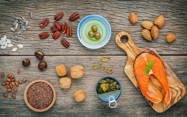 Photo of different foods and seasonings on a wooden table